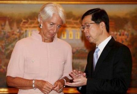 Bank of Thailand Governor Prasarn Trairatvorakul with IMF Managing Director Christine Lagarde
